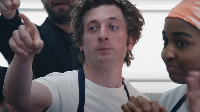 Jeremy Allen White as Carmy in "The Bear" Season 4, cooking in a chaotic kitchen, symbolizing the 2025 culinary comeback.